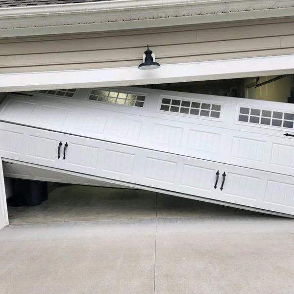 Off-track garage door repair — door off rails Sacramento TX